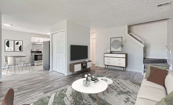a living room with a couch and a table and a tv