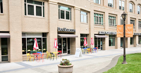 A building with a sign that says Don Marquis.