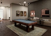 Thumbnail 6 of 6 - A room with a pool table and a couch.