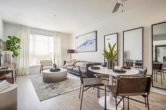 a living room with a round table and a couch
