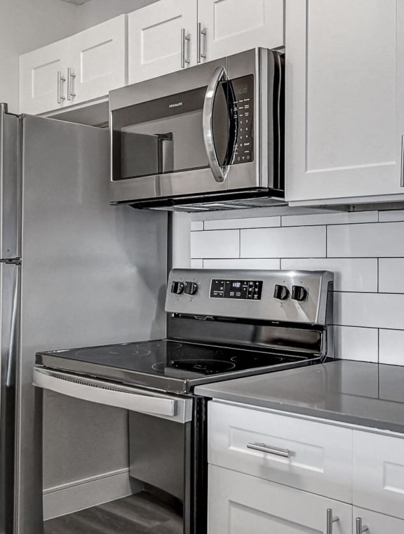 a kitchen with stainless steel appliances and a sink