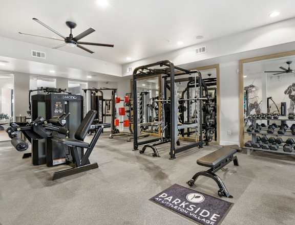 a home gym with weights and cardio machines and a ceiling fan at Parkside at Littleton Village, Littleton, 80122