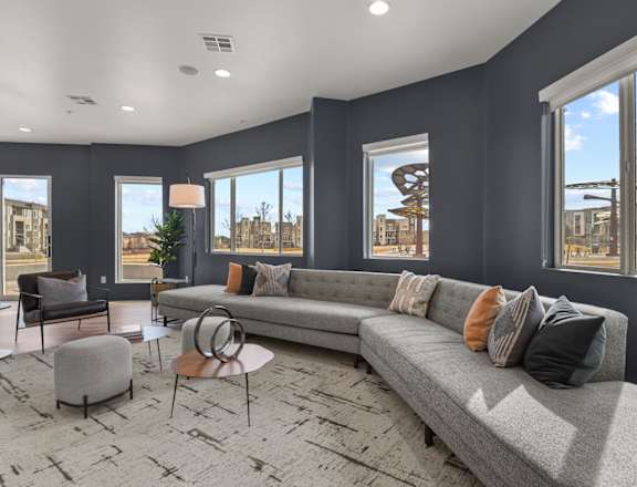 a living room with gray walls and a gray couch at Parkside at Littleton Village, Littleton, 80122
