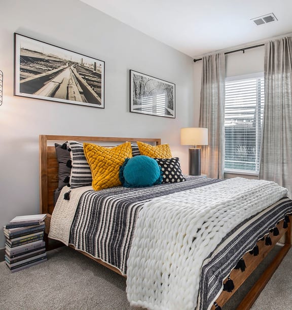 a bedroom with a bed and a dresser