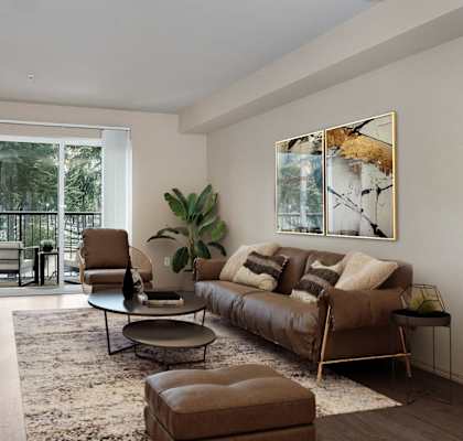 a living room with a couch and a chair and a television