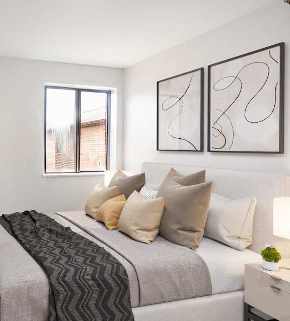 a bedroom with a bed and a kitchen and a living room