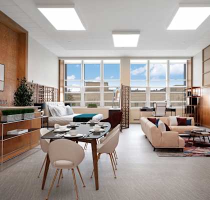 A modern living room with a TV, couches, and a dining table.