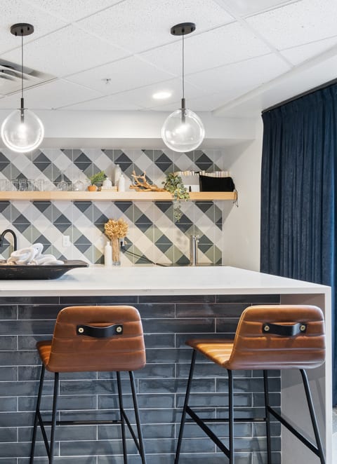a kitchen with stainless steel appliances and a marble counter top at The Bluffs at Nine Mile Creek, Minnesota
