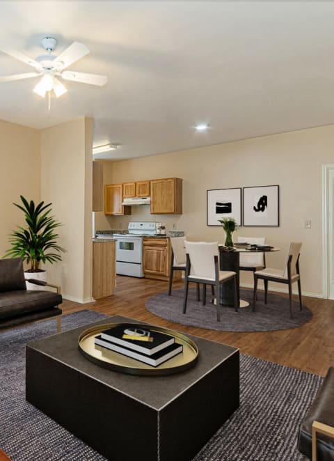 a living room with a couch and a coffee table in front of a dining roomat The Springs, Pasadena, TX 78620