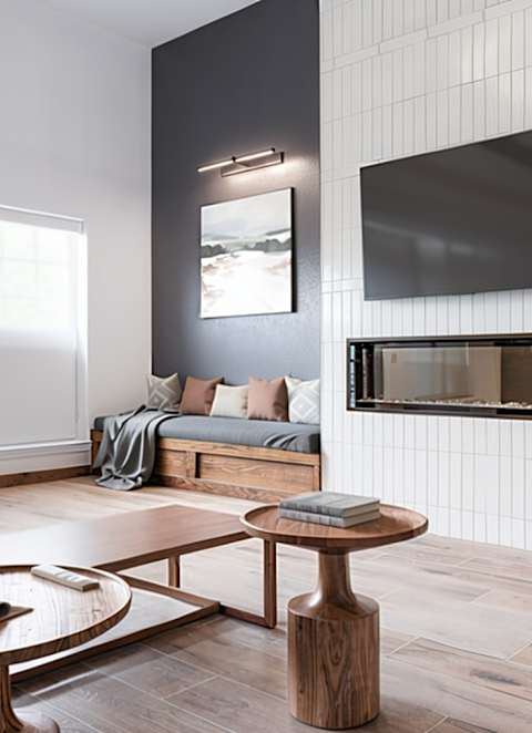 A living room with a sofa, armchair, and coffee table.