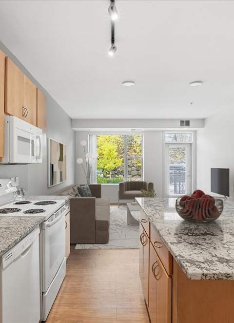 A large open space with a staircase and a couch.