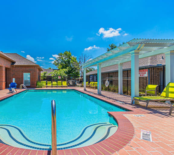 a swimming pool in front of a house