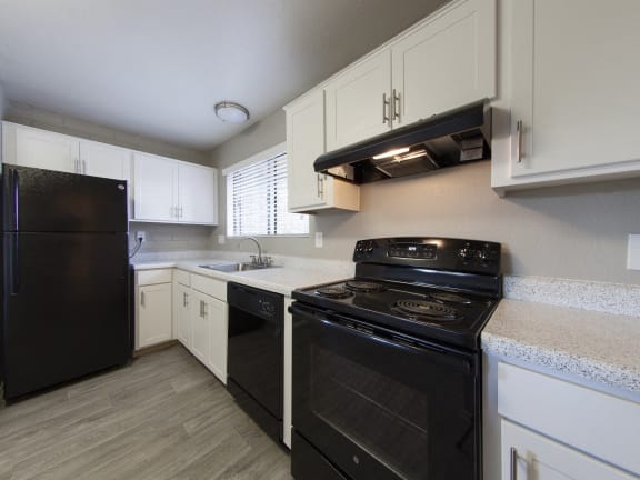 the preserve at ballantyne commons apartment kitchen with black appliances
