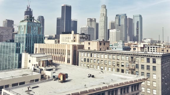 a view of the city skyline from the roof of a building