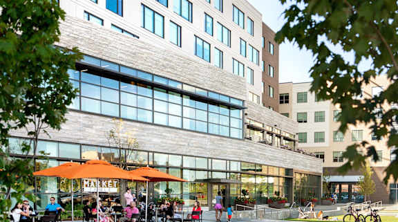 a group of people sitting at tables outside of a restaurant at CityWay Apartments, Indianapolis, IN, 46204