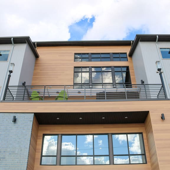 a large building with windows and a balcony at Upscale Living at the Grand off 45th, Fargo, ND, 58104