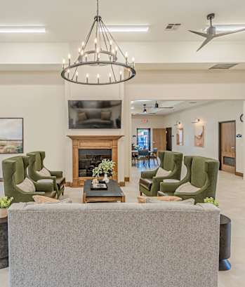 a living room with a pool table and a television