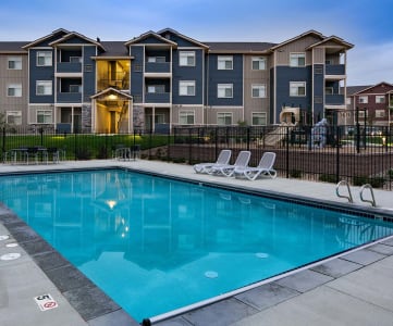 Pool with apt building in background  WA Copper Mountain Apts For Rent