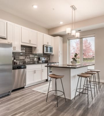 Spacious kitchens feature granite counter tops and spacious open floor plans