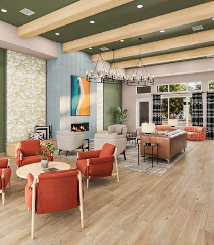 A living room with a fireplace and a dining table.