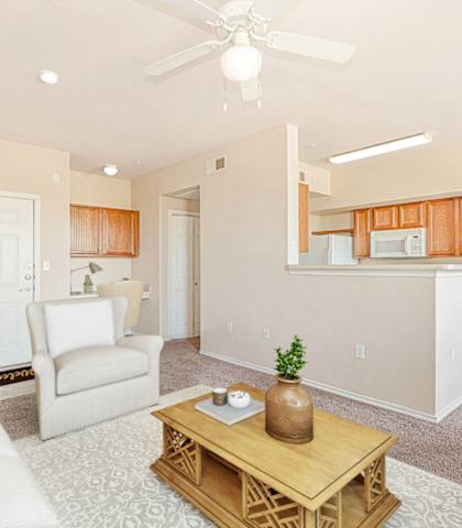 Living Room With Kitchen at The Cesera 55+ Apartments, Garland, TX