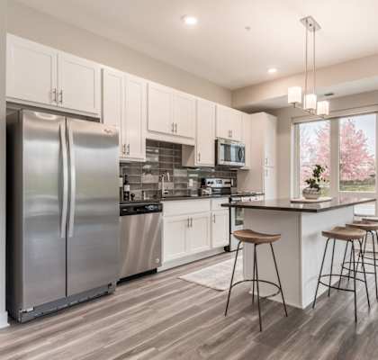 Spacious kitchens feature granite counter tops and spacious open floor plans