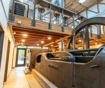 A large industrial machine with the words "BROOKLYN POWER" on it is the focal point of the image.