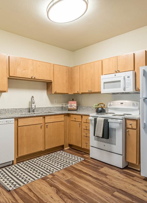 the preserve at ballantyne commons apartment kitchen with stainless steel appliances at Capitol Crossing, Austin, TX 78744