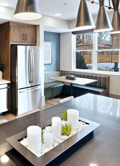 a kitchen with a counter top and a refrigerator at Millberry Apartments, St. Paul Minnesota