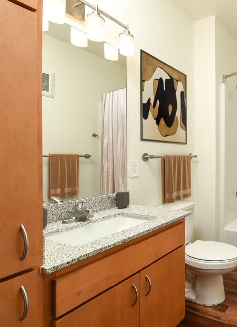 a bathroom with a shower toilet and a sink at Aviara Flats, Phoenix, 85035