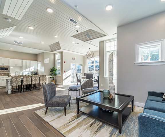 a living room with couches and chairs and a table at Sycamore Ridge, Gainesville, GA