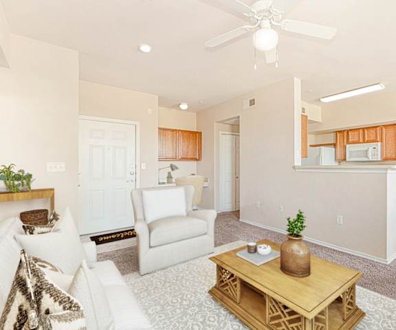 Living Room With Kitchen at The Cesera 55+ Apartments, Garland, TX