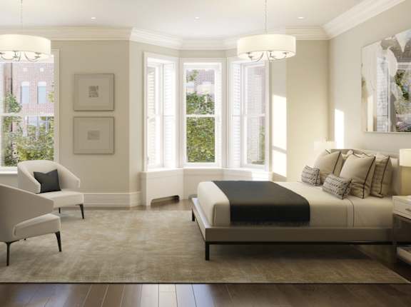 a bedroom with a bed and a rug