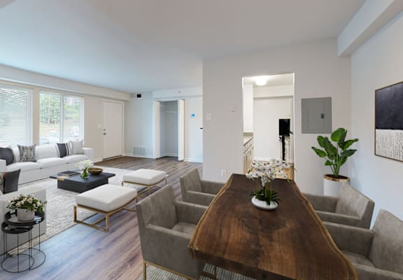 a living room with white walls and hardwood flooring
