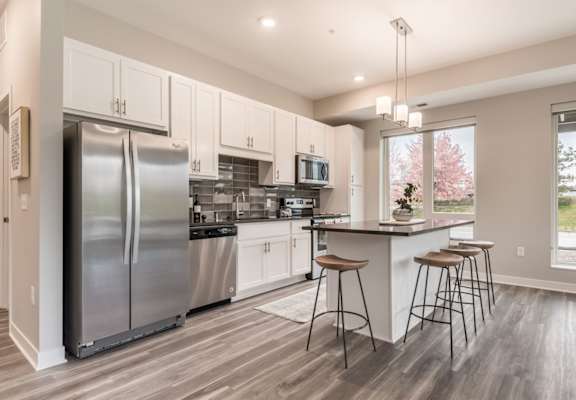 Spacious kitchens feature granite counter tops and spacious open floor plans