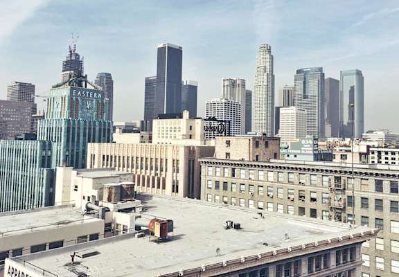a view of the city skyline from the roof of a building