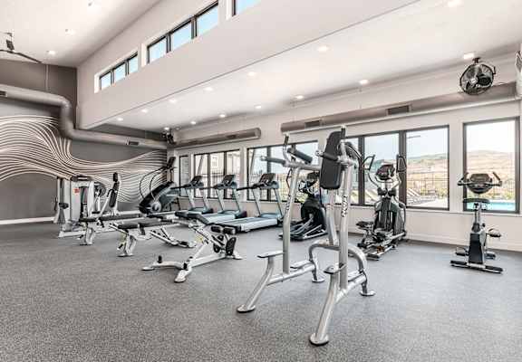Apartment community fitness center featuring a variety of cardio and strength-training equipment