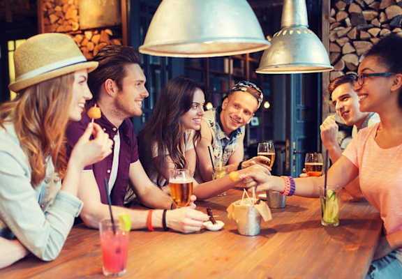 Group of friends eating out at ALTITUDE BY VINTAGE, Reno