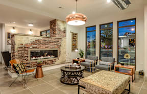 A living room with a fireplace and a couch.