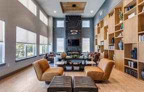 A modern living room with a fireplace and a large window.