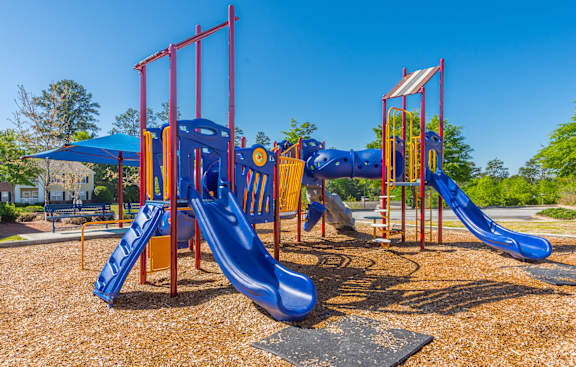 a playground with slides at a park