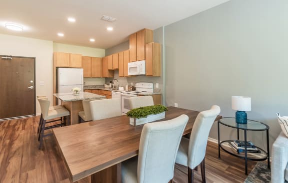 Dining Room With Over-The-Range Microwave at Covington Crossings 55+ Senior Living, Covington, 30014