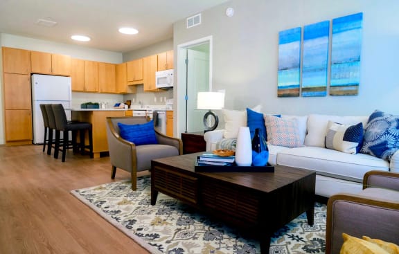 Living Room With Kitchen View at The Legends at Berry 62+ Apartments, St. Paul, MN 55114