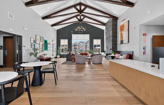 A spacious lobby with a reception desk and seating area.