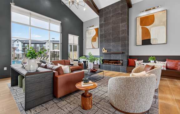 A modern living room with a fireplace and a large window.
