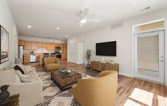 A living room with a brown sofa and a coffee table. at Creekridge on the Park Apartments, Charlotte, NC, 28212