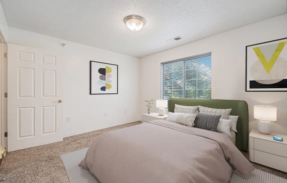 a bedroom with a large bed and a window at Pine Tree Apartments, Omaha, NE 68114