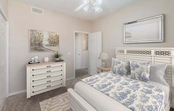 a bedroom with a bed and a dresser at Rosemont at Mayfield Villas, Arlington, Texas