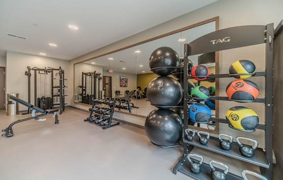 a rendering of a gym with people exercising on treadmills at Shannon Reserve 55+ Apartments, Union City, GA, 30291