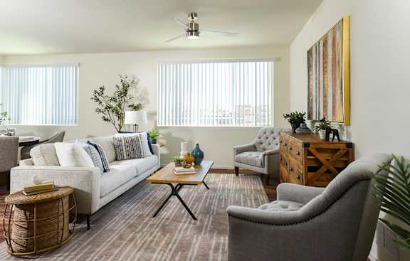 Living Room with Celling Fan at Suncrest Vista at Canyon Trails 55+ Apartments, Goodyear, AZ, 85338